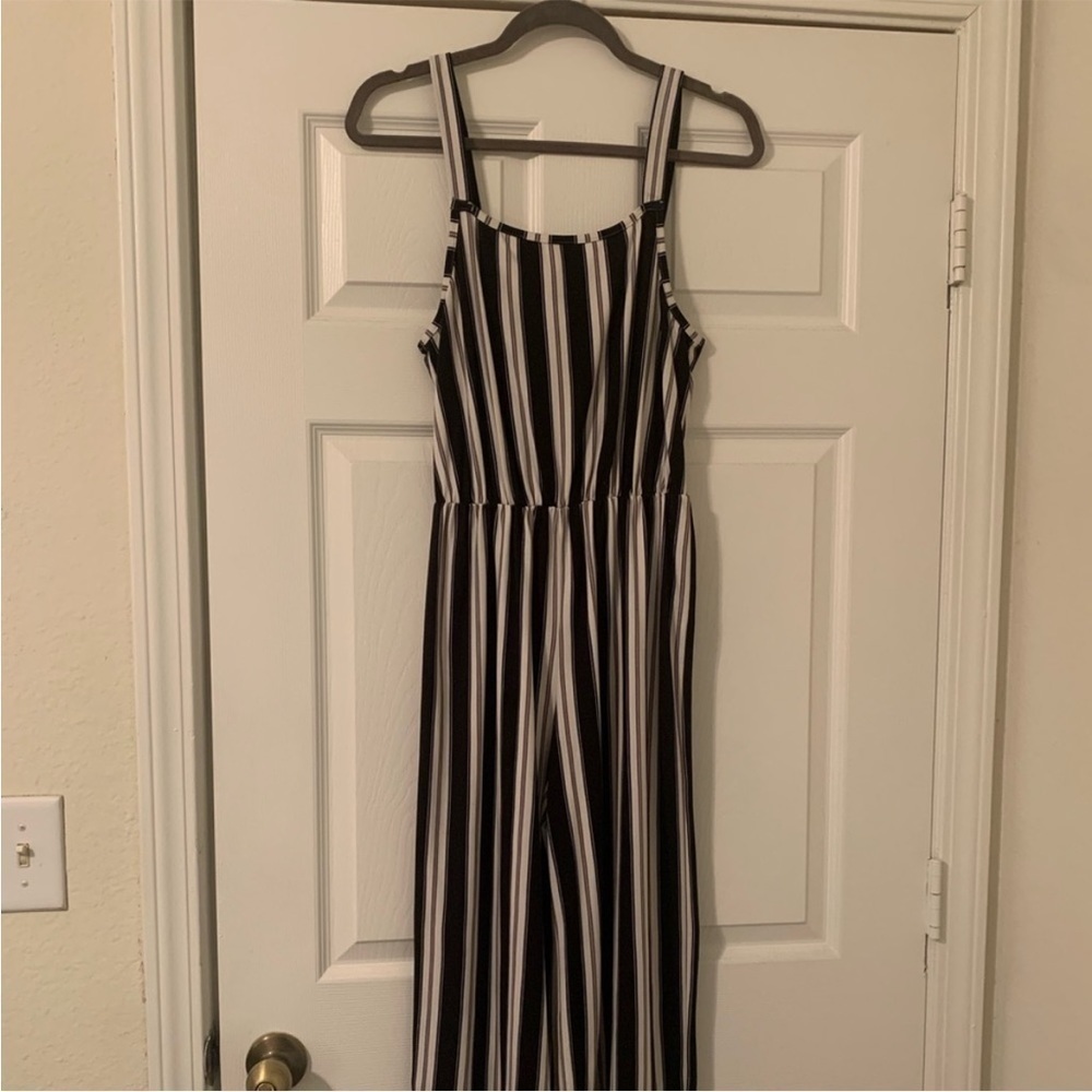 Black and white striped jumpsuit. Size M
